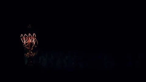 Real light bulb turning on flickering and turning off. Macro. Video stock 79783459