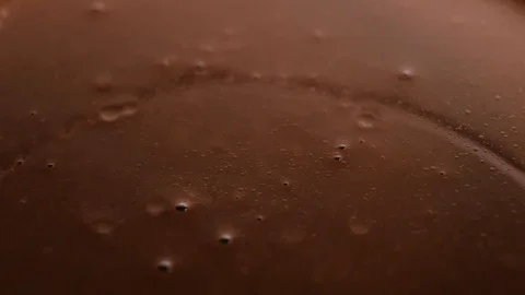 Real liquid chocolate covers nuts. Stock Footage 119474554