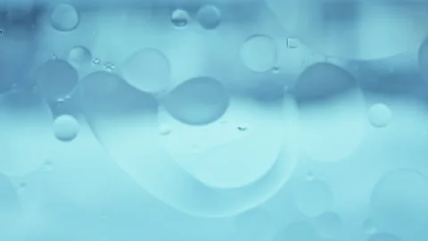 Real Macro Oil Bubble Patterns on Water Color Gradient Motion Stock Footage 334131028
