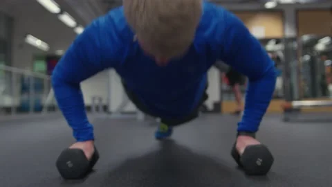 Real man does push ups in Gym, low angle cinematic shallow depth of field Stock Footage 136908716