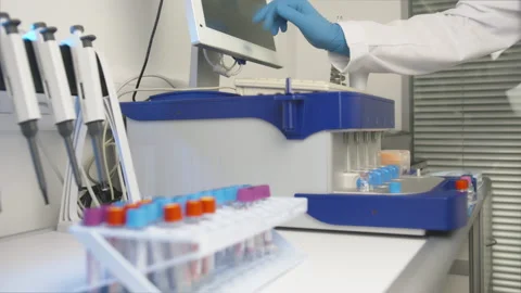 Real Medic Using Micro Pipette for Analysis. Advanced Scientific Lab for Stock Footage 182808415