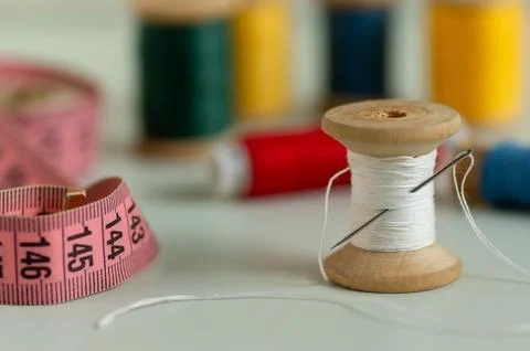 Real old spools of needle and thread meter close-up Stock Photos