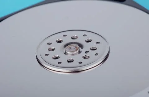 Real open computer hard drive on a blue background Stock Photos