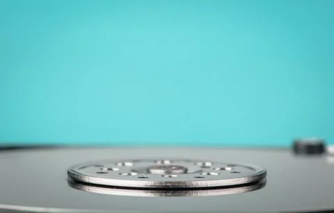 Real open computer hard drive on a blue background Stock Photos