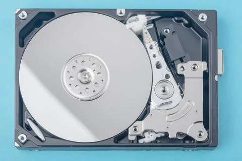 Real open computer hard drive on a blue background Stock-Fotos