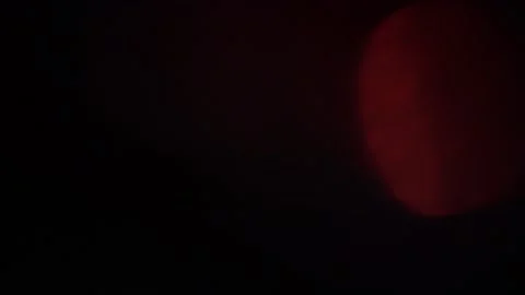 Real optical light leak effect in 4k on dark background Video stock 200515785