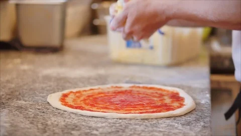 A real pepperoni pizza, a method of its preparation, the Italian chef cooks with Stock Footage 127071742