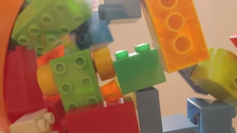 Real plastic toy bricks of various colors, sizes and shapes falling Stock Footage 146298363