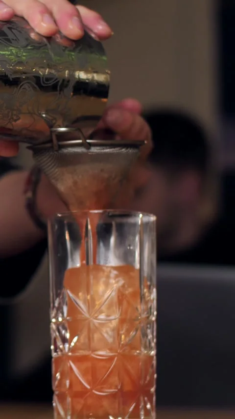 A real professional bartender creating a cocktail. Stock Footage 305256855