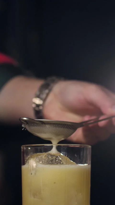 A real professional bartender creating a cocktail. Stock Footage 305257057