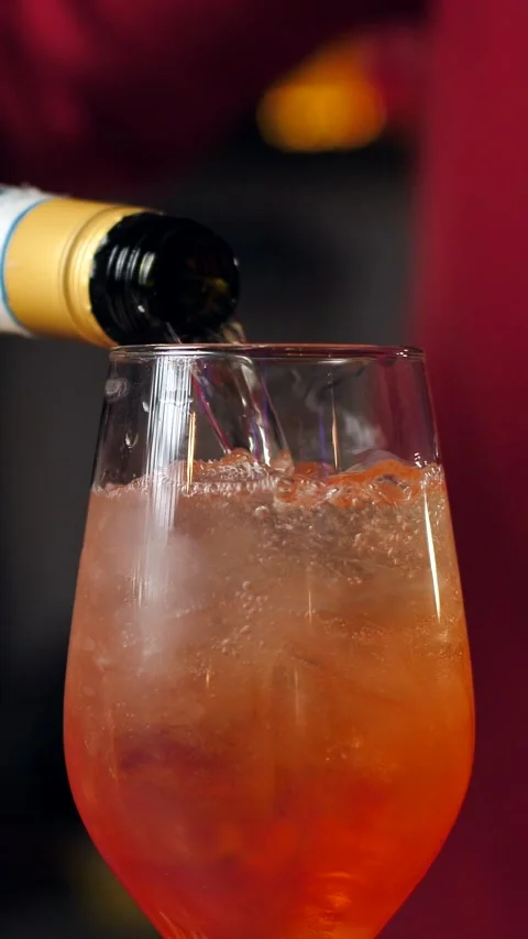 A real professional bartender creating a cocktail. Experienced bartender pouring Stock Footage 305447940