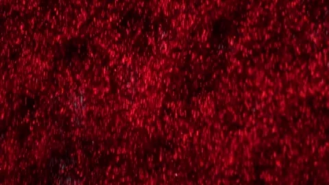 Real Red Glitter Falling in high frame rate slow motion 1000 frames per second Stock Footage 258690205