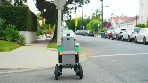 Real robot crossing the intersection in Los Angeles Stock Footage 243639945