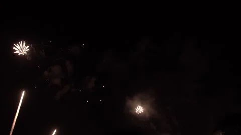 Real Shining Fireworks Display New year's Celebration in Night Sky.	Slow motion. Stock Footage 296819732