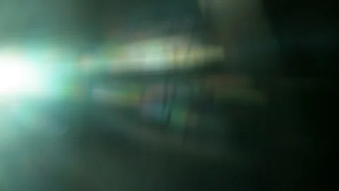 Real Shooted Anamorphic Lens Flare Transitions on Black Background in Slow Stock Footage 333623205