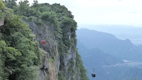Real Shot of Cable Car Moving Up and Down in Mountain Canyon Stock Footage 337929502