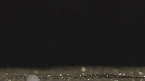 Real shot of gold particles Stock Footage 141467337
