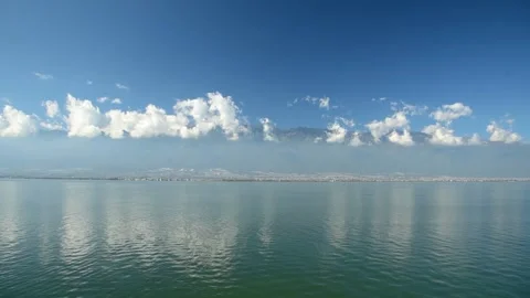 Real shot mirror lake distant mountain clear sky lake scenery in Dali Yunnan Video stock 337923799