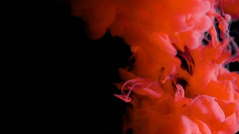 Real shot red paint drops in water in slow motion inversion. Ink swirling Stockbeeldmateriaal 105156370
