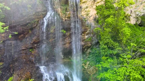 Real Shot of Wide Multi Layer Waterfall in Mountain Forest Video stock 337942131