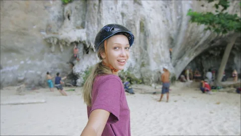 Real, slow-motion of young couple holding hands, woman leading boyfriend, walkin Stock Footage 201097140