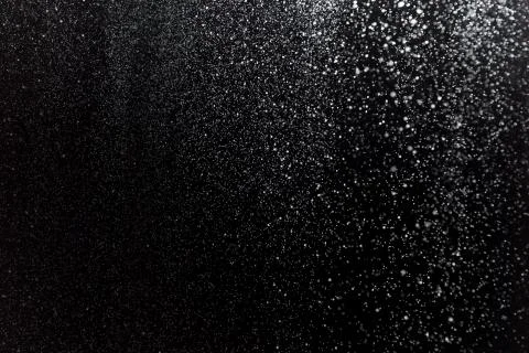 Real snow on black background Stock Photos