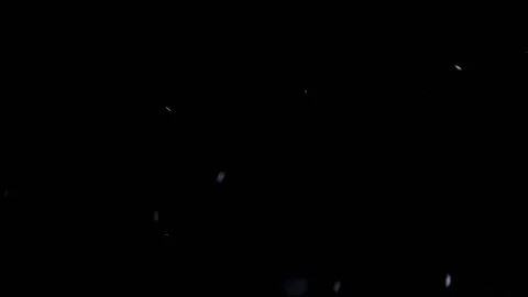 Real snow falling Isolated black Background Video stock 133958584