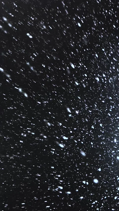 Real snow falls on camera. Falling snow. Heavy snowfall video. Winter fairy tale Stock Footage 261222580