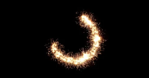 Real sparklers bundle draws glowing fire ring circle on black background Stock Footage 326133938