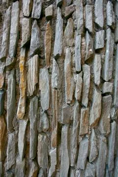 Real stone wall surface with cement Stock Photos