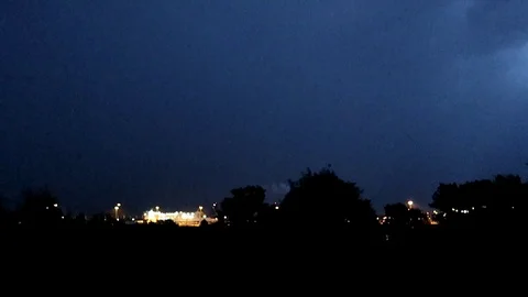 Real thunderstorm with lots of lightning over the harbor Stock Footage 114829256