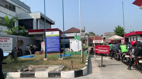 Real Time 4K Motorcycles Queue at Pertamina Fuel Station Stock Footage 339378797