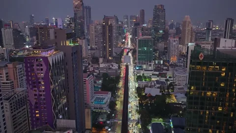 Real-time Aerial Night View Of Traffic Of Bangkok City With Towering Condos Stock Footage 330292883