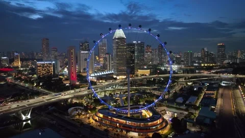 Real time aerial video of Sunset in Singapore City Skyline, Singapore Flyer Stock Footage 331190193