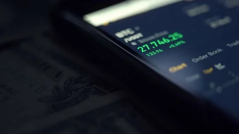 Real-time analysis of the cryptocurrency market in a smartphone. macro. Stock Footage 236477230