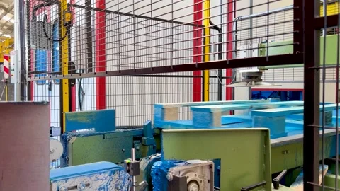 Real-time automatic process of painting blue Europallets while moving on a Stock Footage 257876148