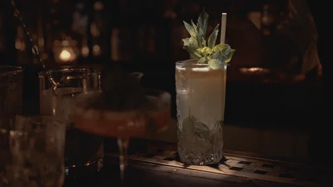 Real time close up shot of a bartender preparing a cocktail at a bar in Bangkok Stock-Footage 128655778