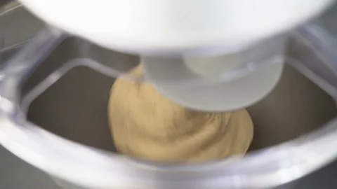 Real time closeup of kneading machine and dough for homemade bread and pizza Stock Footage 215919723