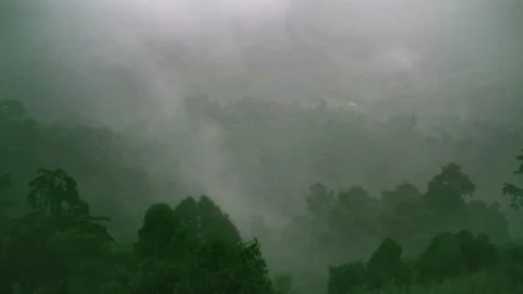 Real time cloud moving over the Green mountain in a heavy Rainy day Stock Footage