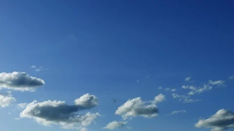 Real time clouds against blue gradient sky Stock Footage 100692921