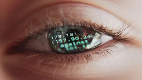 Real-time data on global cyber attacks reflected in a blue eye, macro shooting Stock Footage 281930526