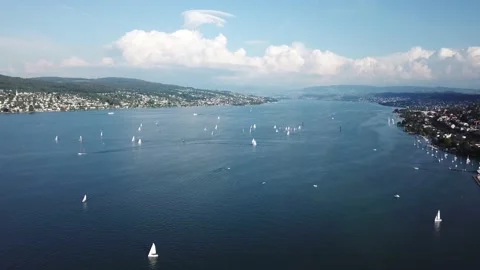 Real time drone flight of lake Zurich with a lot of sailboats and water sports Stock Footage 156490540