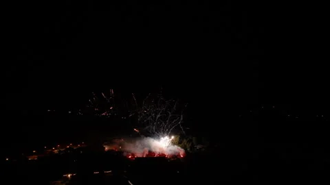 Real-Time Fireworks Display Over City at Night Stock Footage 291737218