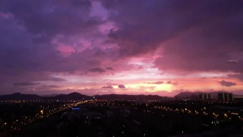 Real time footage of dramatic sunset sky in city Stock Footage 196450613