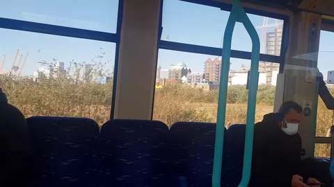 Real time, London train with commuter with face mask Stock Footage 127301697