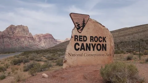 Real time pan right to the Red Rock Canyon National Conservation Area sign Stock Footage 137674711
