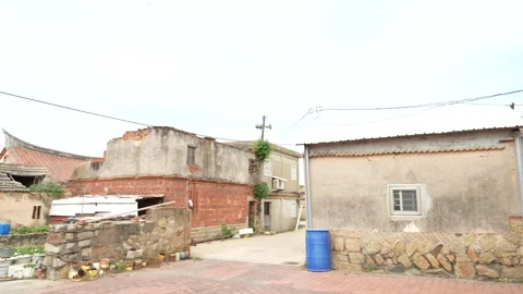 Real-time pan shot of war damaged old village of Kinmen Taiwan Stock Footage 321624831