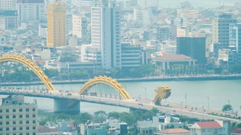 Real time shot of Dragon bridge in DaNang Vietnam with moving vehicles and Stock Footage 163365777
