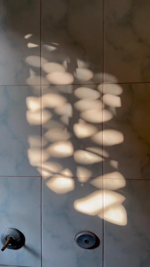 A real time shot of A tap with Shadow of balcony grill Stock Footage 223906649
