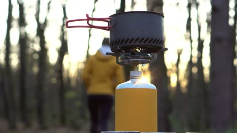 Real time shot of a touristic pot with a boiling water on a camping gas sto.. Stock Footage 255238568